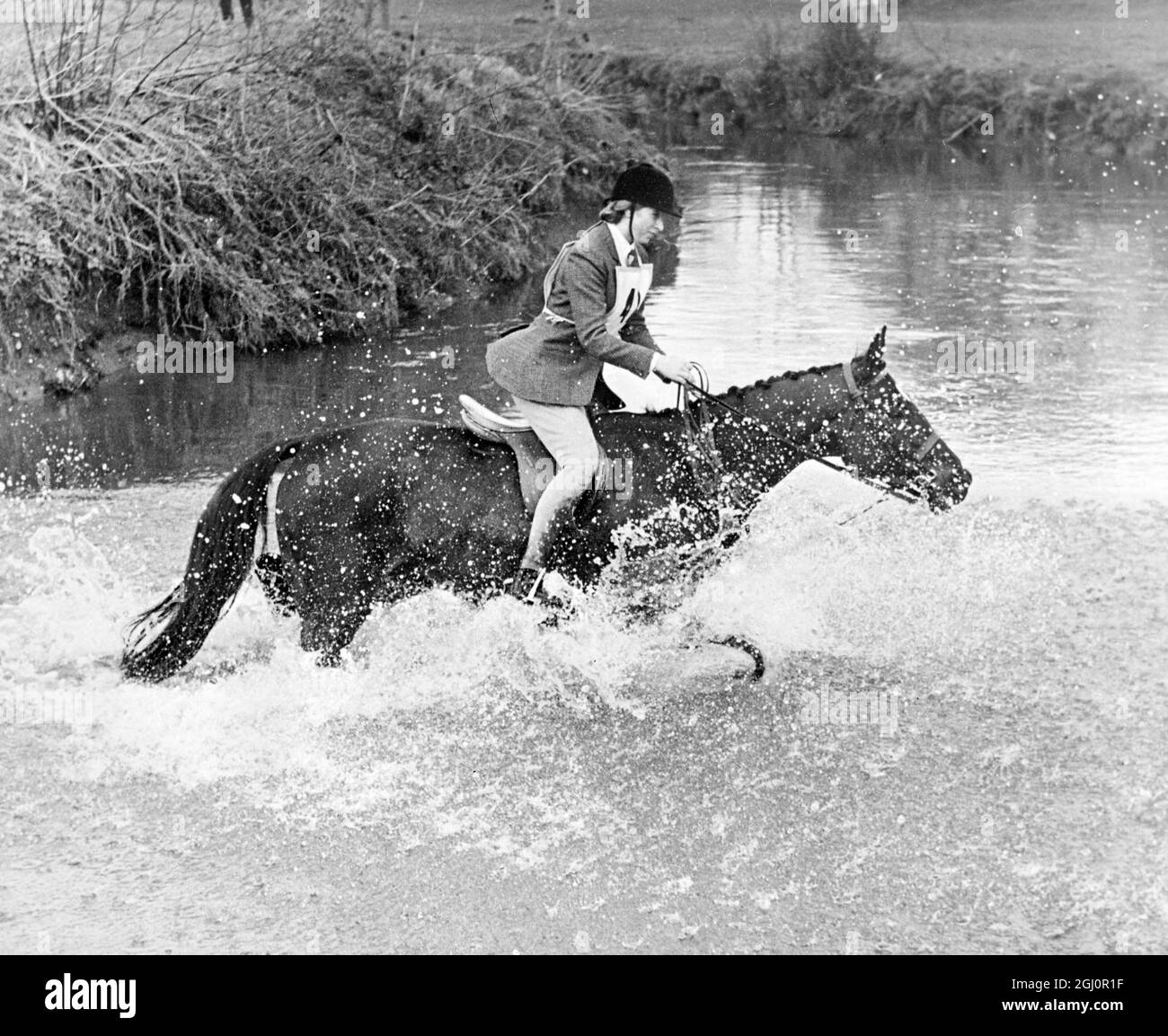 Intrepid Royal horsewoman . Reading, Berkshire : Fording the River Blackwater amidst a cloud of spray is Princess Anne , 15 , as she took part in the Staff College and Sandhurst Hunt's Pony Club Hunter Trials , at Hill Farm at Farley Hill , near Reading on Wednesday . Princess Anne , riding '' Blue Star '' , won the Open event for riders under 21 from a field of forty competitors . 6 April 1966 Stock Photo