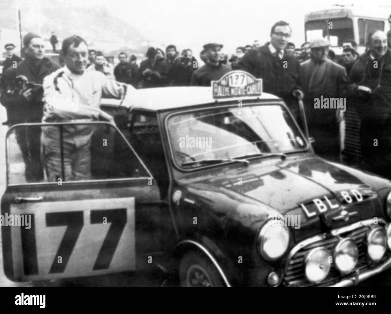 Monte Carlo , Monaco : Seen today 20 January 1967, with their British Mini Cooper car wfter winning the 36th Monte Carlo rally are Finland 's Rauno Aaltonen ( Left) and Britain's Henry Liddon (right , glasses) . They are seen here after the time trial. 20 January 1967 Stock Photo