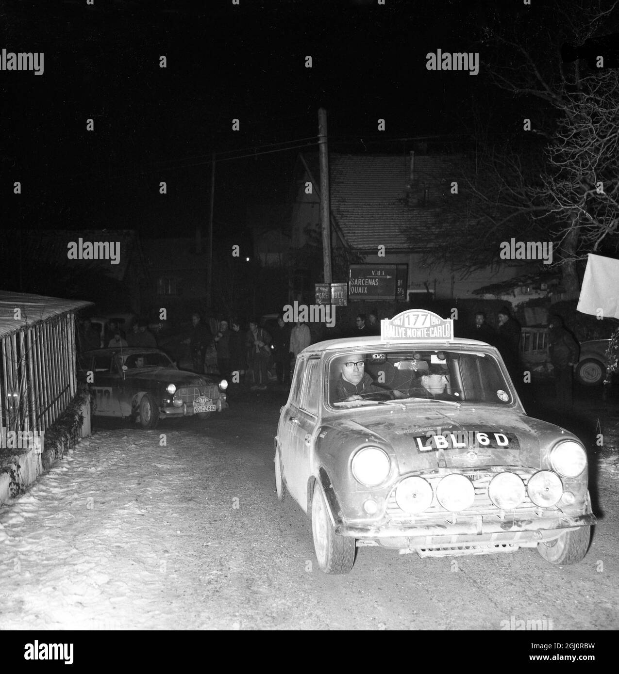 Grenoble , France : Finland's Rauno Aaltonen and co-driver Henry Liddon , driving a mini-cooper pictured during the Monaco-Chambery-Monaco common alpine night-lap of the Monte Carlo rally , 18 January . The rally finished in complete confusion this morning after a second-by-second battle through severe weather conditions in the Southern French montains . Aaltonen appeared to be the the winner but lack of precise information about vital times meant that Sweden's Oven Anderson ina Lancia might yet take first place . 20 January 1967 Stock Photo