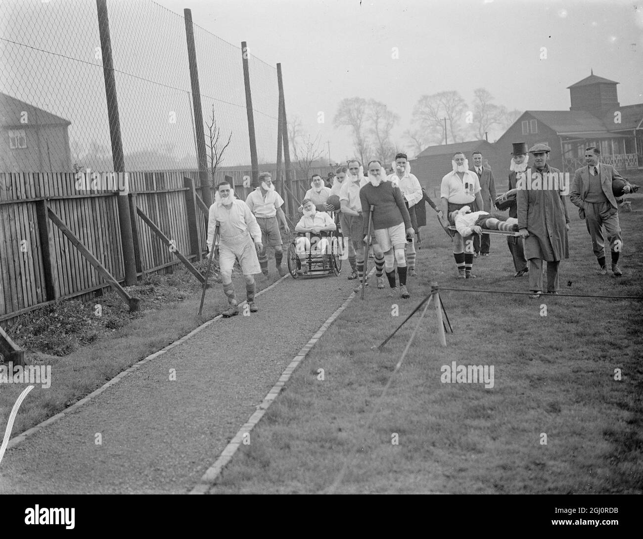 Police comic football- Shooters Hill . 1945. Bandaged, top hat, stretcher Stock Photo