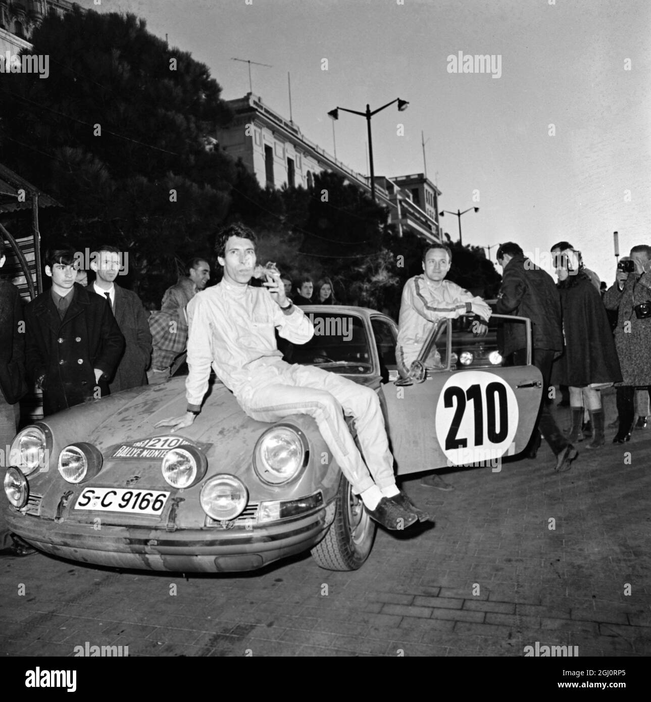 BRITONS WIN MONTE CARLO RALLY MONACO; Young british drivers Vic Elford (left) 32, and David Stone, 27, with their 180hp two litre German works Porsche 911-T after completing the complimentary mountain leg of the 37th Monte Carlo Rally here. The British pair won the rally. Stock Photo