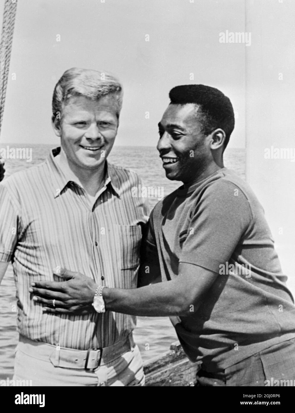 Two of the world's leading footballers, Germany's Helmud Haller and Pele from Brazil. Relaxing on a yacht hired by Haller who plays for the Bologna team in Italy. Riccione, Italy - 20 July 1967 Stock Photo