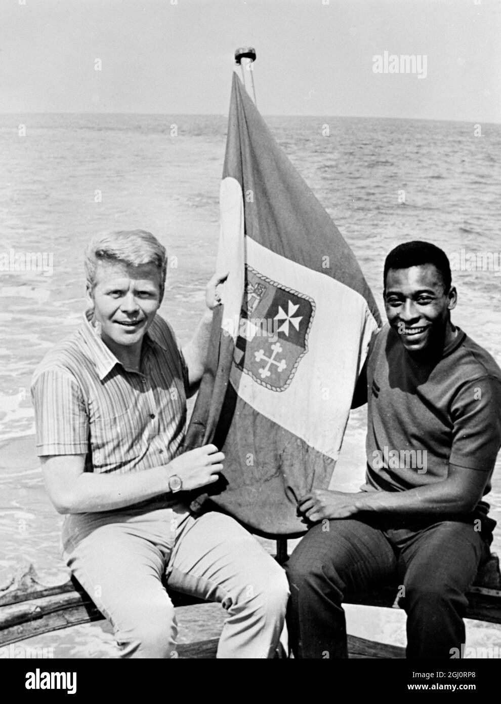 Two of the world's leading footballers, Germany's Helmud Haller and Pele from Brazil. Relaxing on a yacht hired by Haller who plays for the Bologna team in Italy. Riccione, Italy - 20 July 1967 Stock Photo