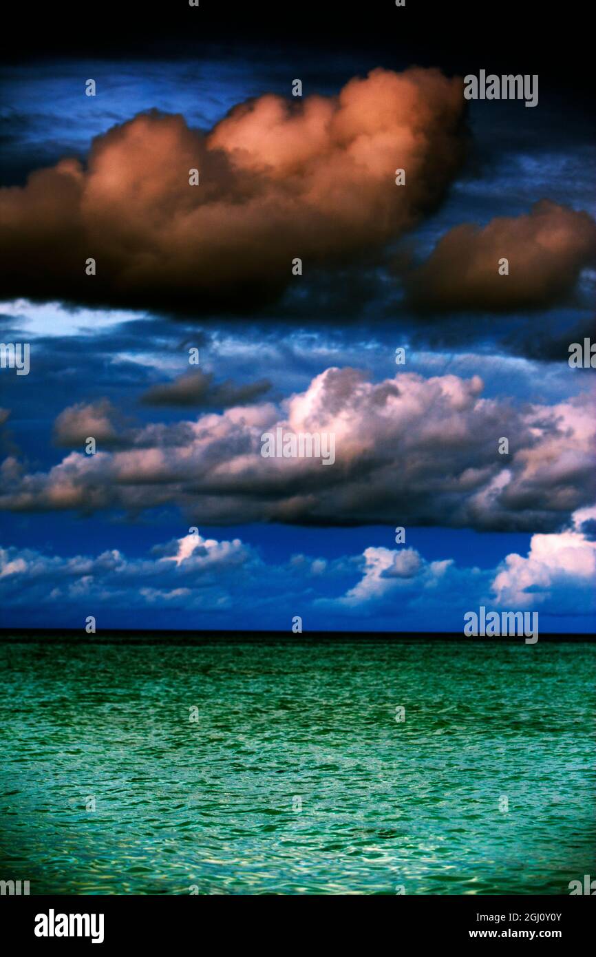 Mid-day puffy clouds over the Green ocean (the Sulu Sea) The Philippines Stock Photo