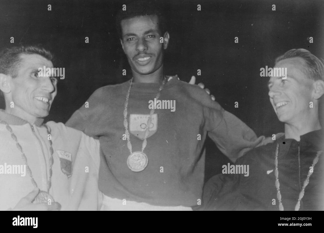 OLYMPIC GAME MARATHON ABEBE WITH GOLD RHADI SILVER MAGEE BRONZE 11 SEPTEMBER 1960 Stock Photo
