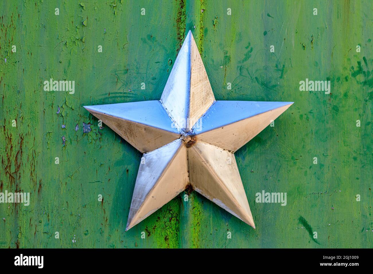 Ukraine, Pripyat, Chernobyl. Decorative silver Soviet star on a green wall. Stock Photo