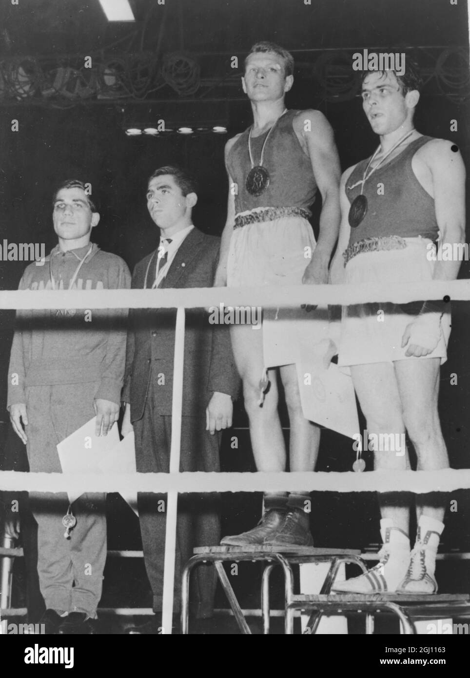 Russia's BORIS LAGUTIN takes the winners podium after taking the Gold Medal for the light middleweight bout in the European Amateur Boxing Championships 10 June 1961 . He beat DIETER NEIDEL of East Germany AND ERIH SCHICHTA of West Germany and Rumanian VIRGIL BADEA - IN BELGRADE , SERBIA . 13 JUNE 1961 Stock Photo