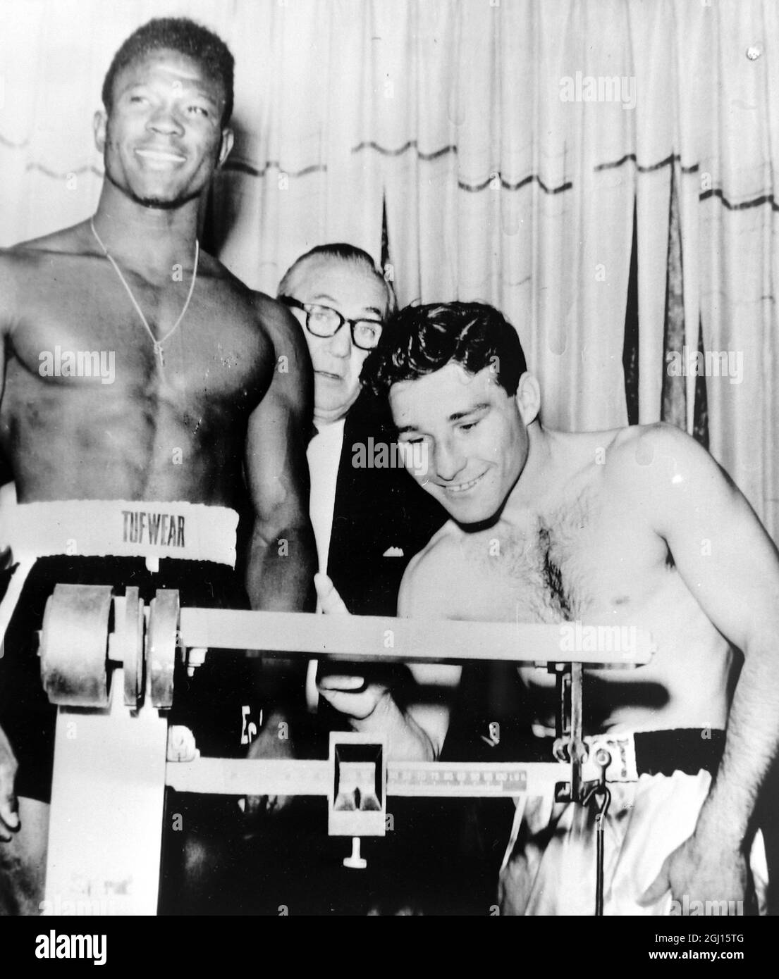 BOXER JORGE FERNANDEZ FALLS IN ACTION WITH EMILE GRIFFITH IN LAS VEGAS- ; 10 DECEMBER 1962 Stock Photo