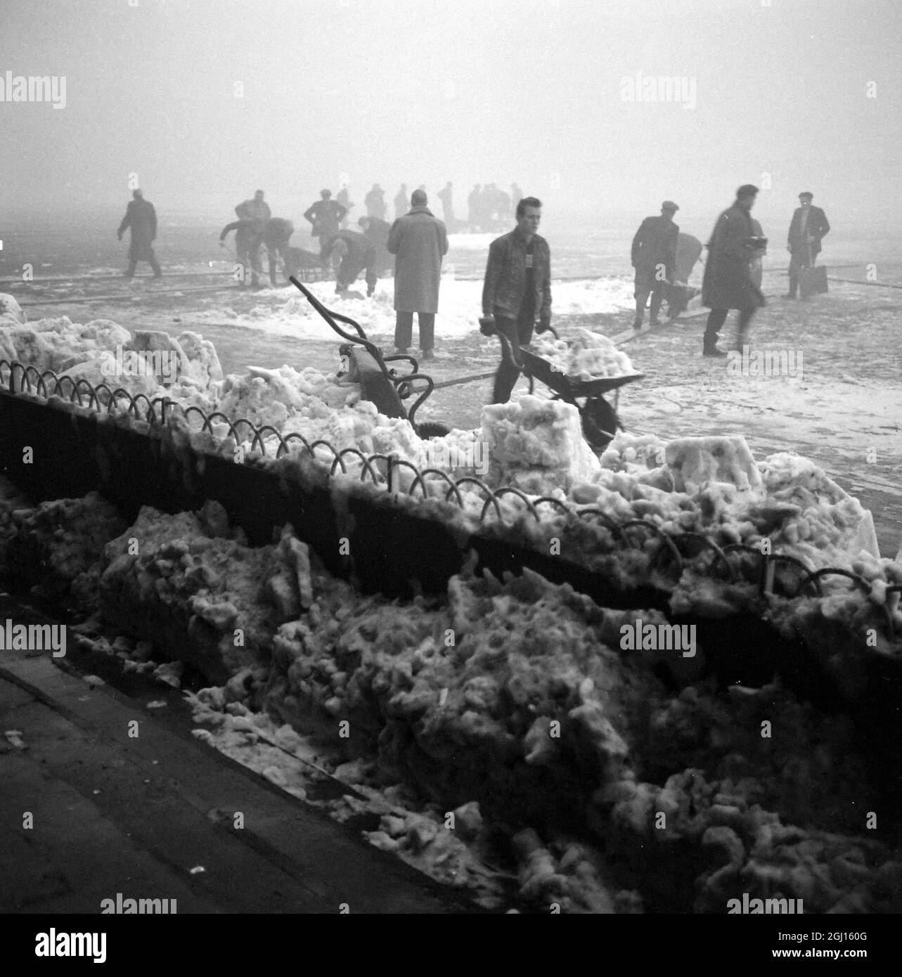 FOOTBALL GROUNDSMEN CLEAR GROUND AT WHITE HART LANE IN LONDON ; 4