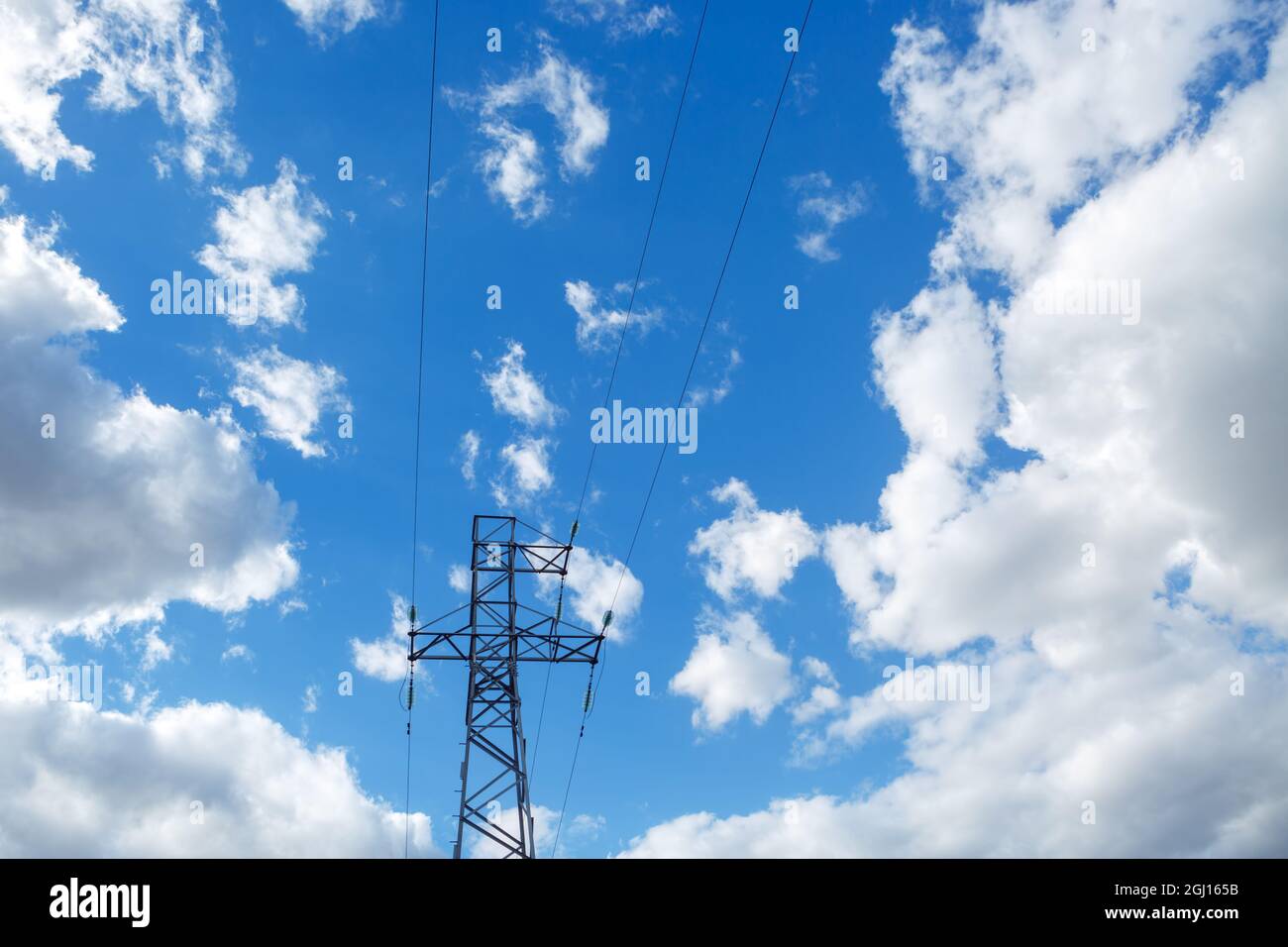 High voltage power line on blue sky background with clouds Stock Photo ...