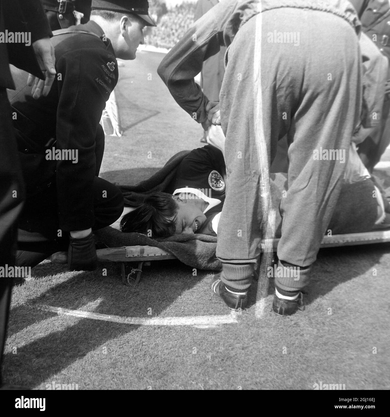 FOOTBALL SCOTLAND V ENGLAND CALDOW IN PAIN OFF PITCH BROKEN LEG ; 6 APRIL 1963 Stock Photo