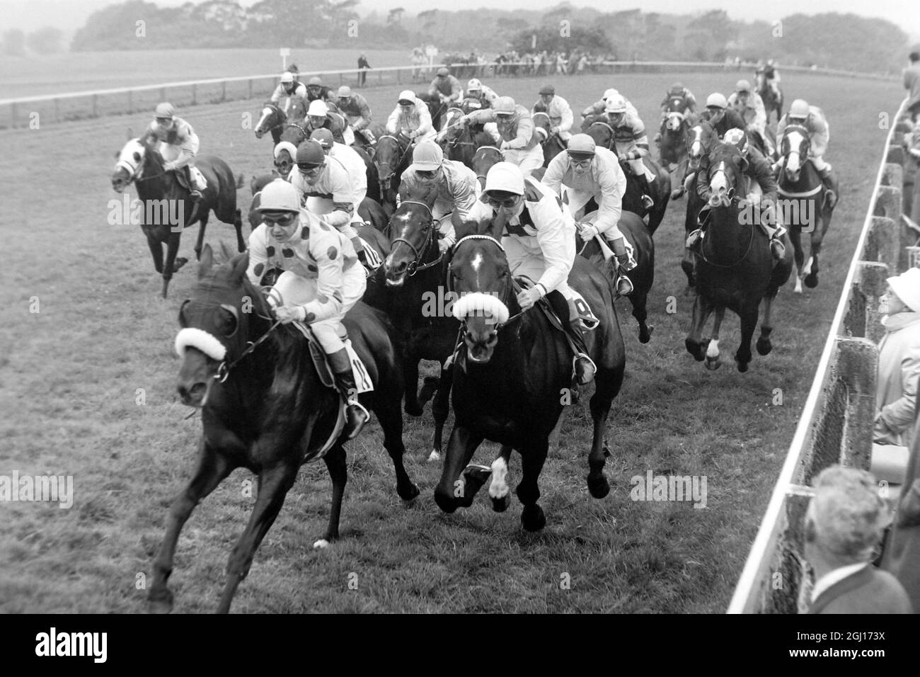 29 MAY 1963 HORSES REACH THE MILE POST IN THE DERBY. RELKO WITH YVES SAINT-MARTIN UP WON THE RACE AND CAN BE SEEN IN THE CENTRE OF THE PICTURE BETWEEN AND BEHIND THE TWO HORSES WITH THE NOSEBANDS. EPSOM, SURREY, ENGLAND. Stock Photo