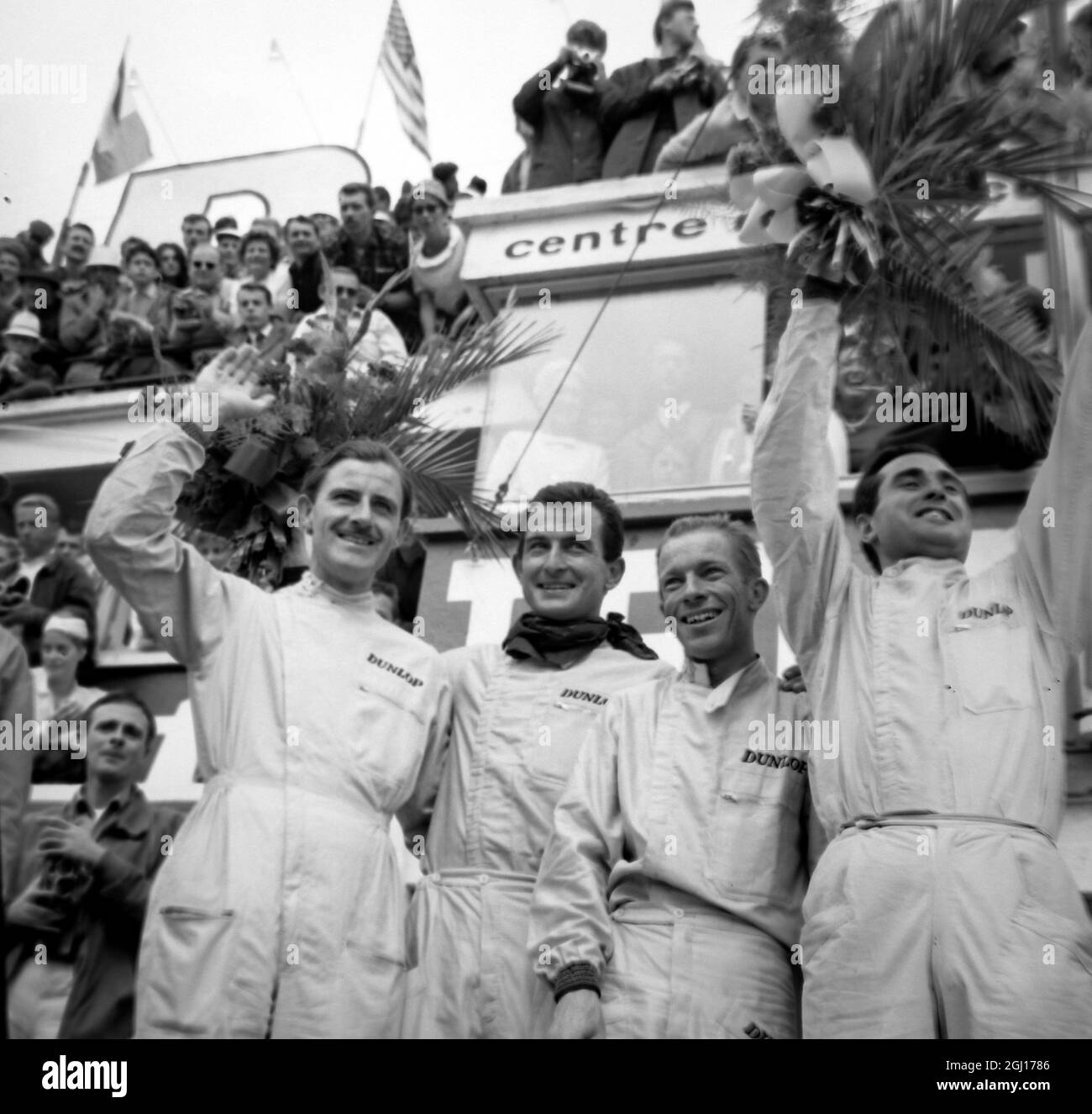 WINNERS OF THE 24 HOUR LE MANS RACE ITALIAN DRIVERS SCARRIOTTI AND BANDINI WITH WORLD CHAMPION GRAHAM HILL AND RITCHIE GINTHER IN FRANCE ; 18 JUNE 1963 Stock Photo