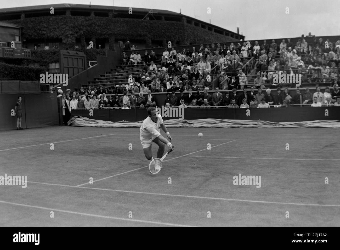 CHUCK MCKINLEY IN ACTION AT TOURNAMENT IN WIMBLEDON INTERNATIONAL