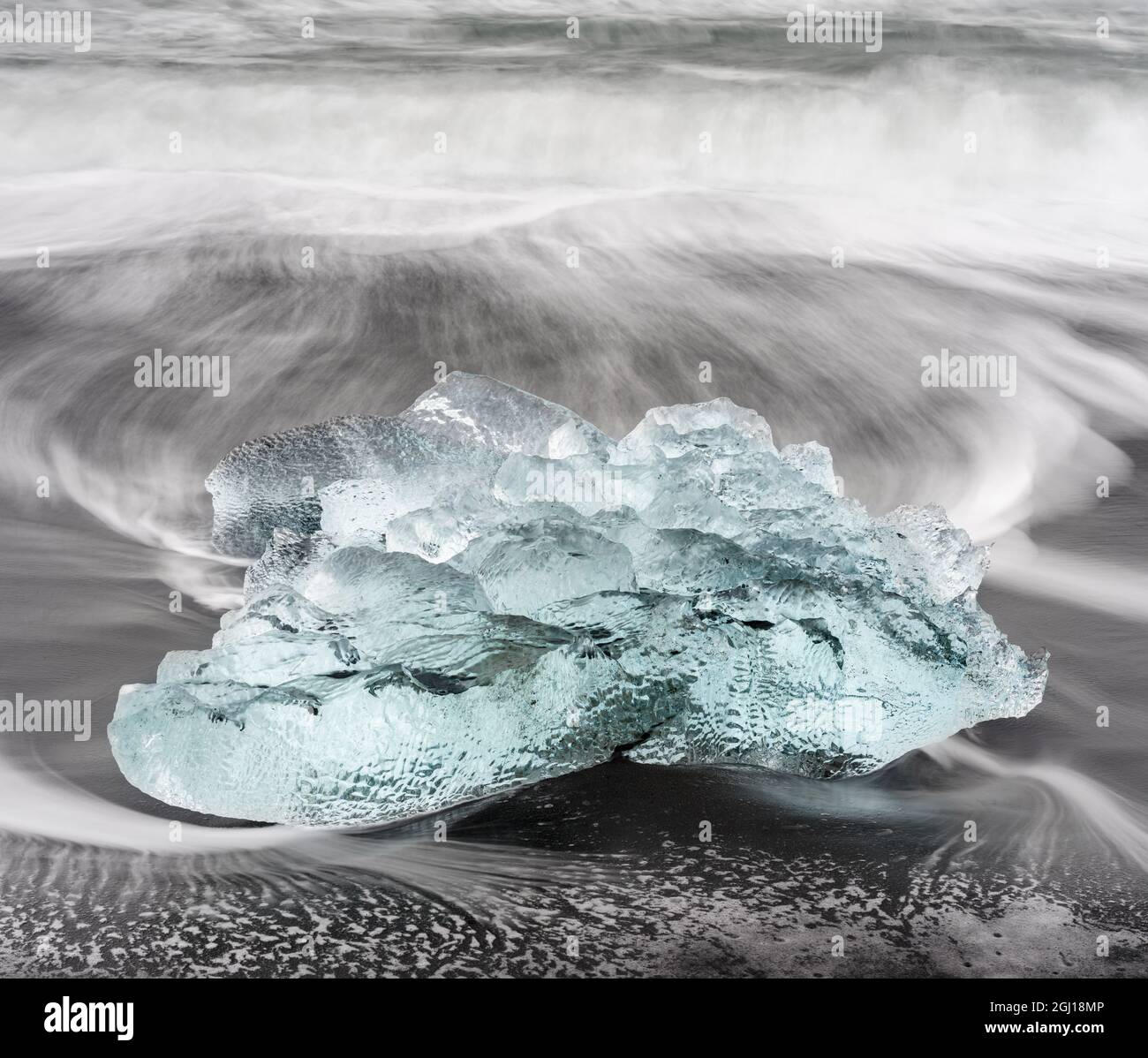 Icebergs on black volcanic beach near the Jokulsarlon glacial lagoon and Breithamerkurjokull glacier in the Vatnajokull National Park, Iceland. Stock Photo