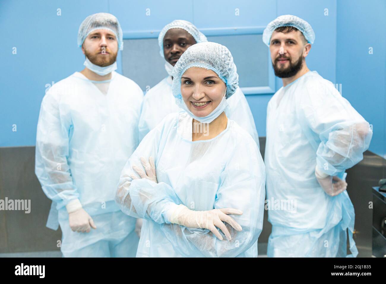 Doctors In Uniform Portrait of a team of doctors in uniform and medical masks after ...
