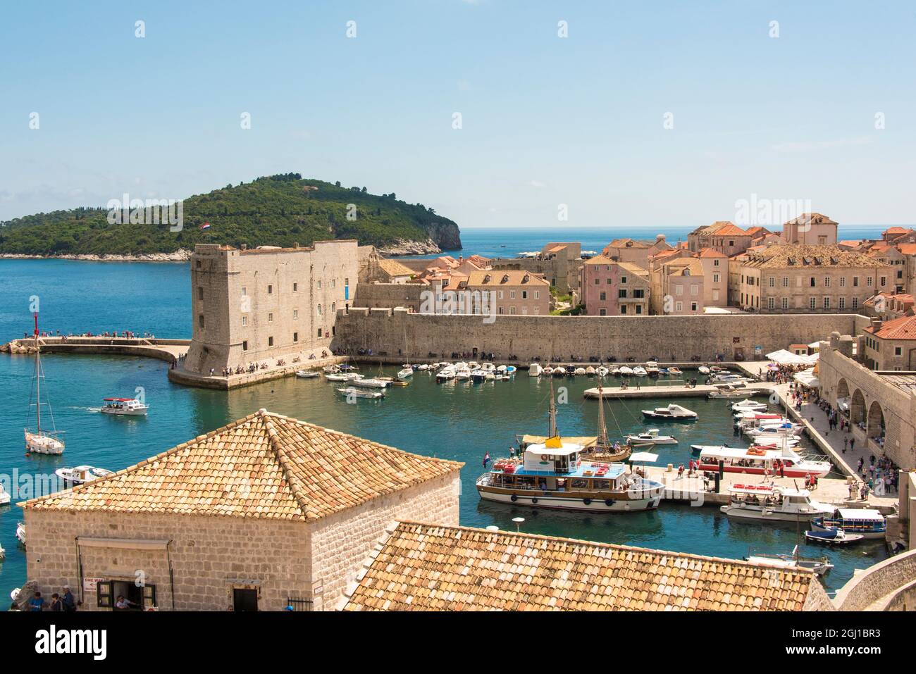 Croatia, Dubrovnik. Walled city old town and marina. St. John Fortress (Sveti Ivan) called Mulo Tower. Lokrum island offshore. Stock Photo