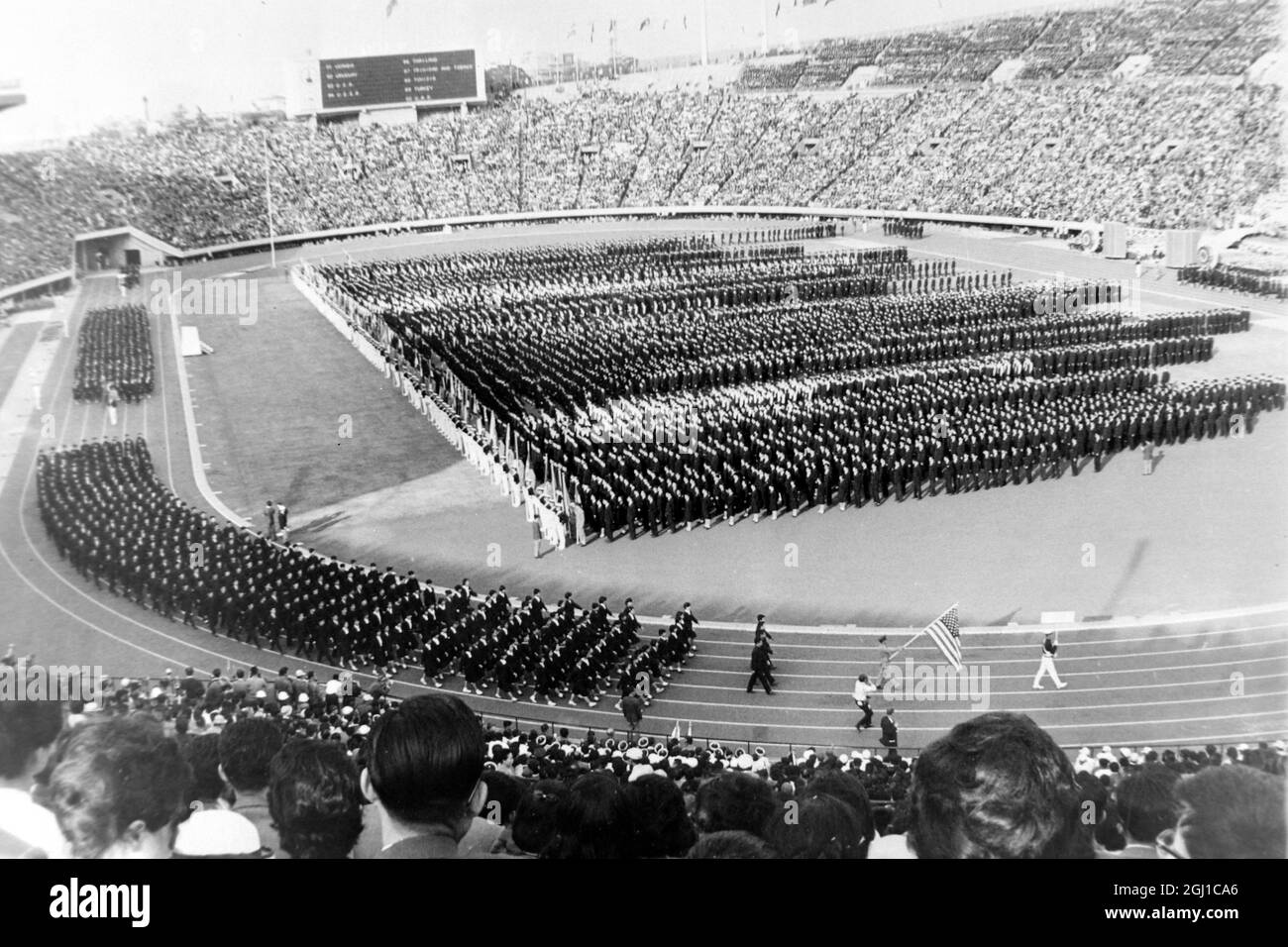 OLYMPICS, OLYMPIC SPORT GAMES - THE XVIII 18TH OLYMPIAD IN TOKYO, JAPAN - DRESS REHERSAL JAPANESE SCHOOLCHILDREN TAKE ATHLETE PLACES ; 3 OCTOBER 1964 Stock Photo
