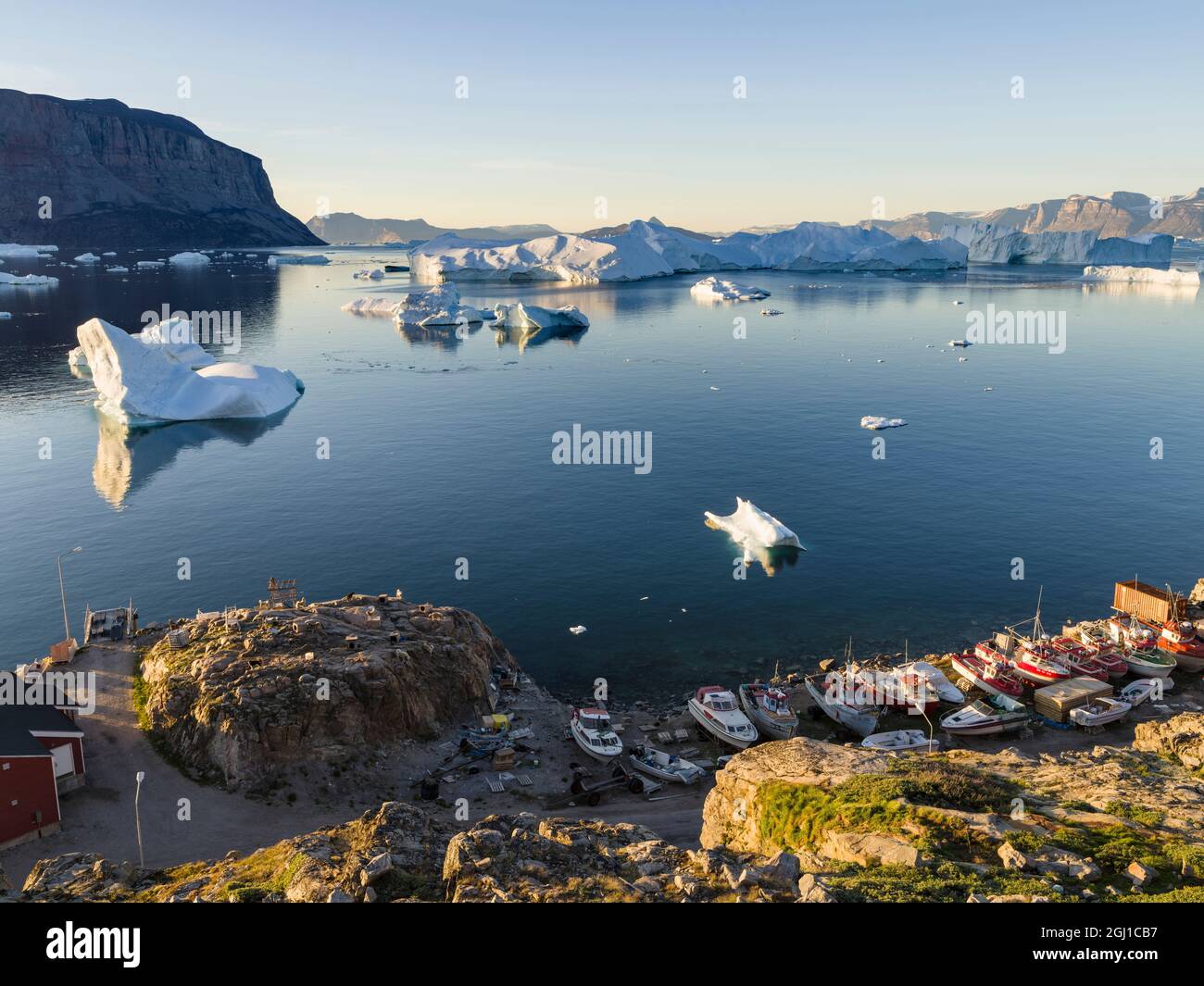 View of fjord full of icebergs towards Nuussuaq peninsula during midnight sun. Stock Photo