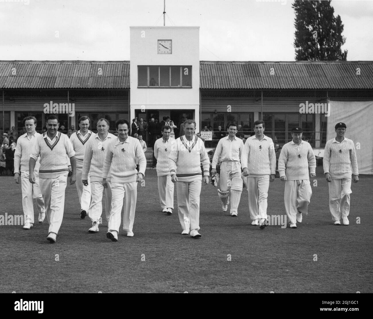Local Cricketer makes county debut John Dye of Frindsbury Cricket Club is on the extreme left behind captain Colin Cowdrey as the team takes the field at Hesketh Park Dartford in the match Kent Vs Gloucestershire 1962 Stock Photo