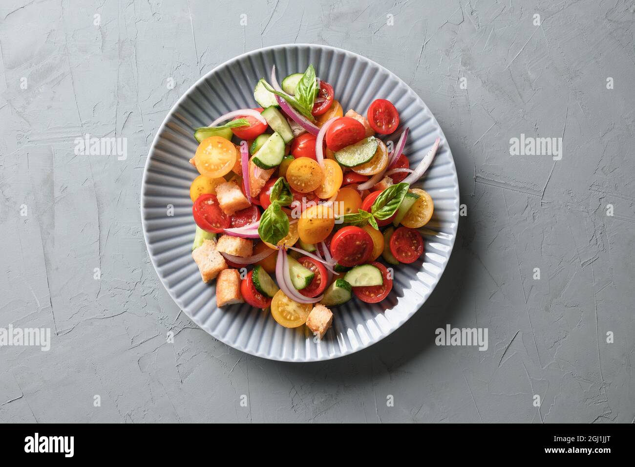 Tuscan Panzanella With Tomatoes And Bread On Gray Concrete Background ...