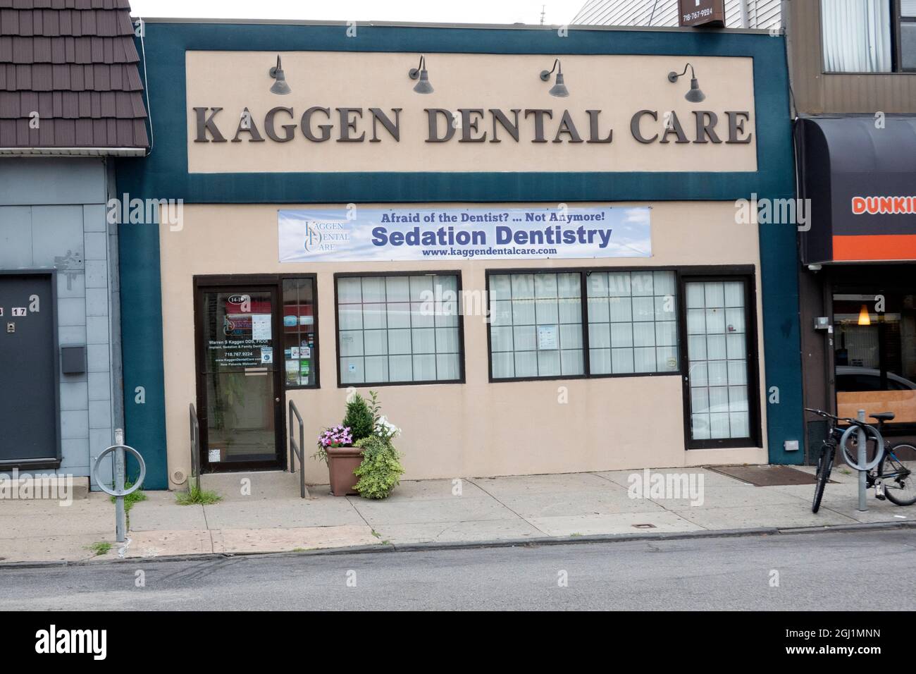 The exterior of a dental office attempting to attract people afraid of dentists by readily offering sedation. In Whitestone, Queens, New York Citty. Stock Photo