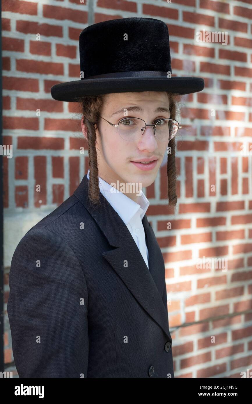 Posed portrait of a teenage Hasidic Jewish boy from the Satmar group ...