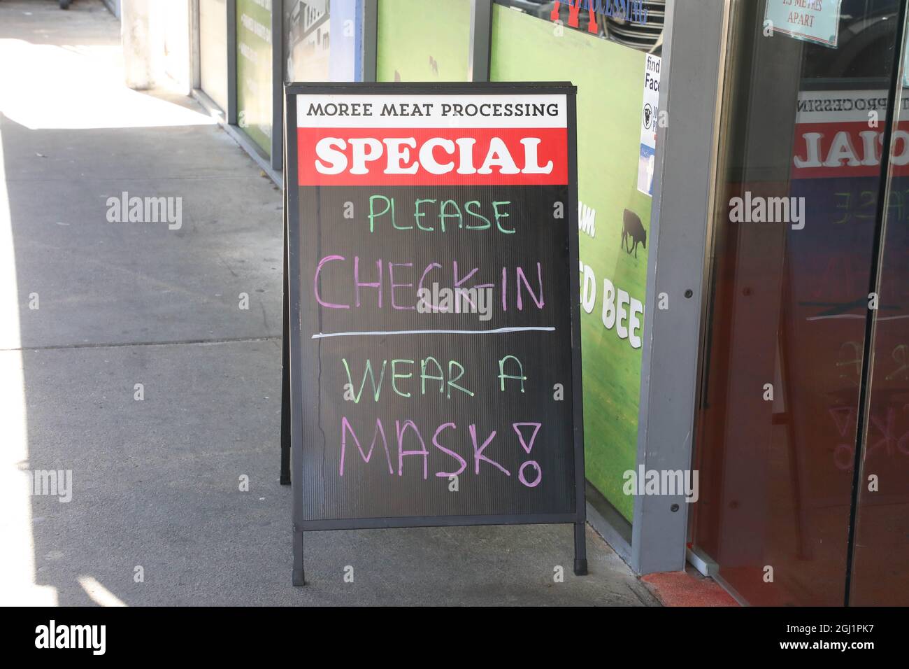 Sydney, Australia. 8th September 2021. Covid 19 please check-in wear a mask! Sign at Moree Meat Processing, 1/22 George St, North Strathfield NSW 2137. Credit: Richard Milnes/Alamy Live News Stock Photo