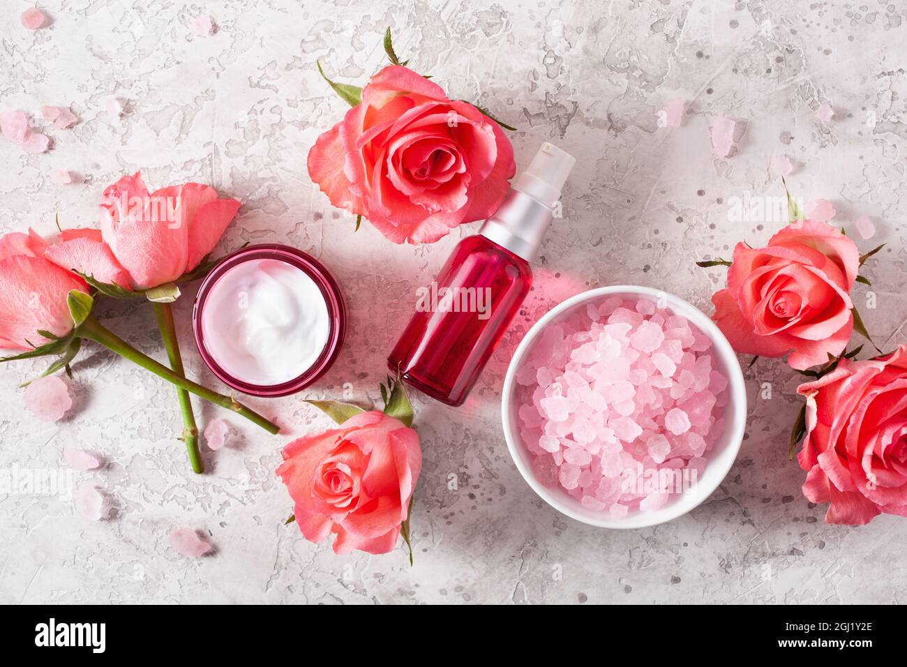 bottles skincare lotion serum medical rose flowers. organic natural cosmetic Stock Photo