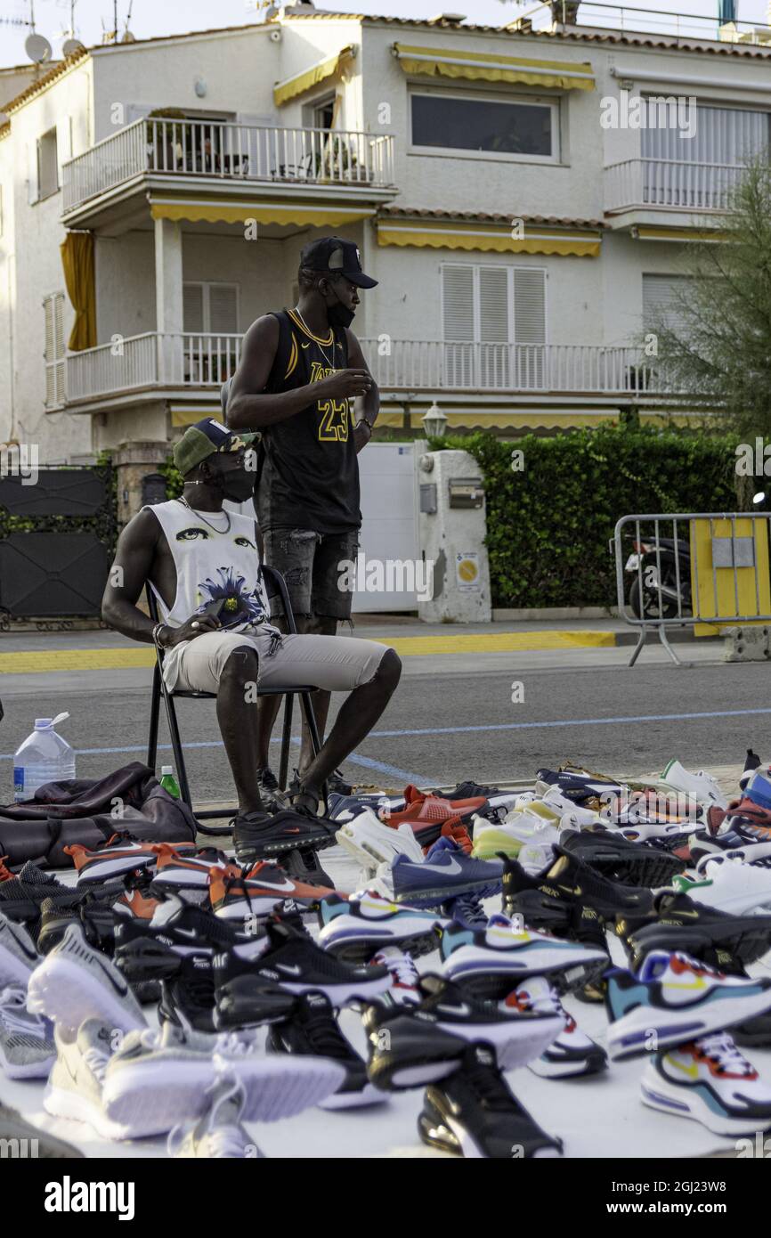 barcelona-spain-oct-26-2020-the-black-man-selling-clothes-on-the-street-2GJ23W8.jpg