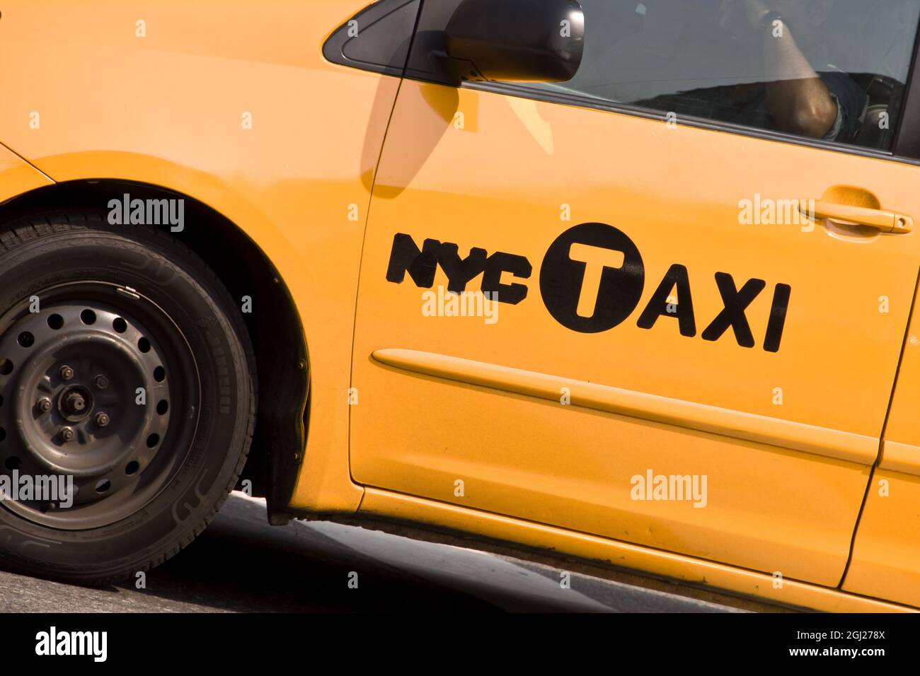Close on the logo of a yellow NYC Taxi in New York City Stock Photo
