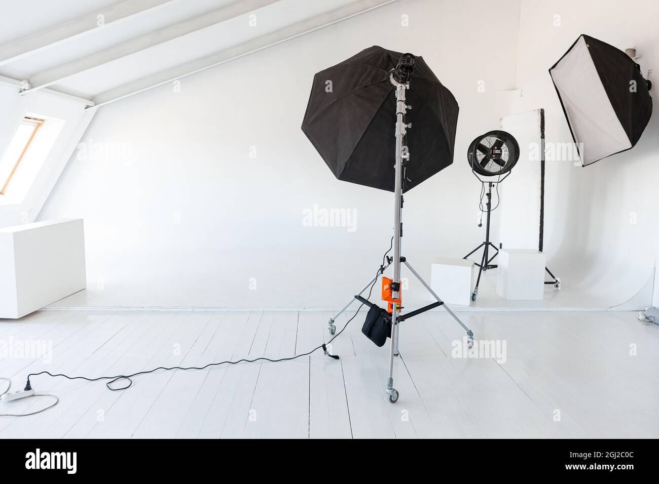 Empty photo studio with lighting equipment. Professional camera, lenses and  filters for photographer Stock Photo - Alamy