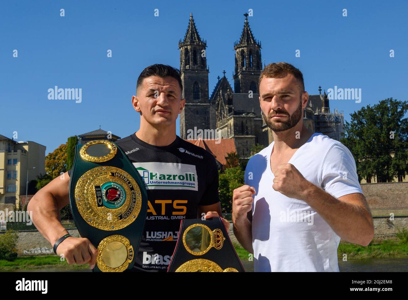 Magdeburg, Germany. 08th Sep, 2021. Robin Krasniqi (l), world champion  light heavyweight and Dominic Bösel, former world champion light  heavyweight, stand next to each other on an excursion boat. The two boxers