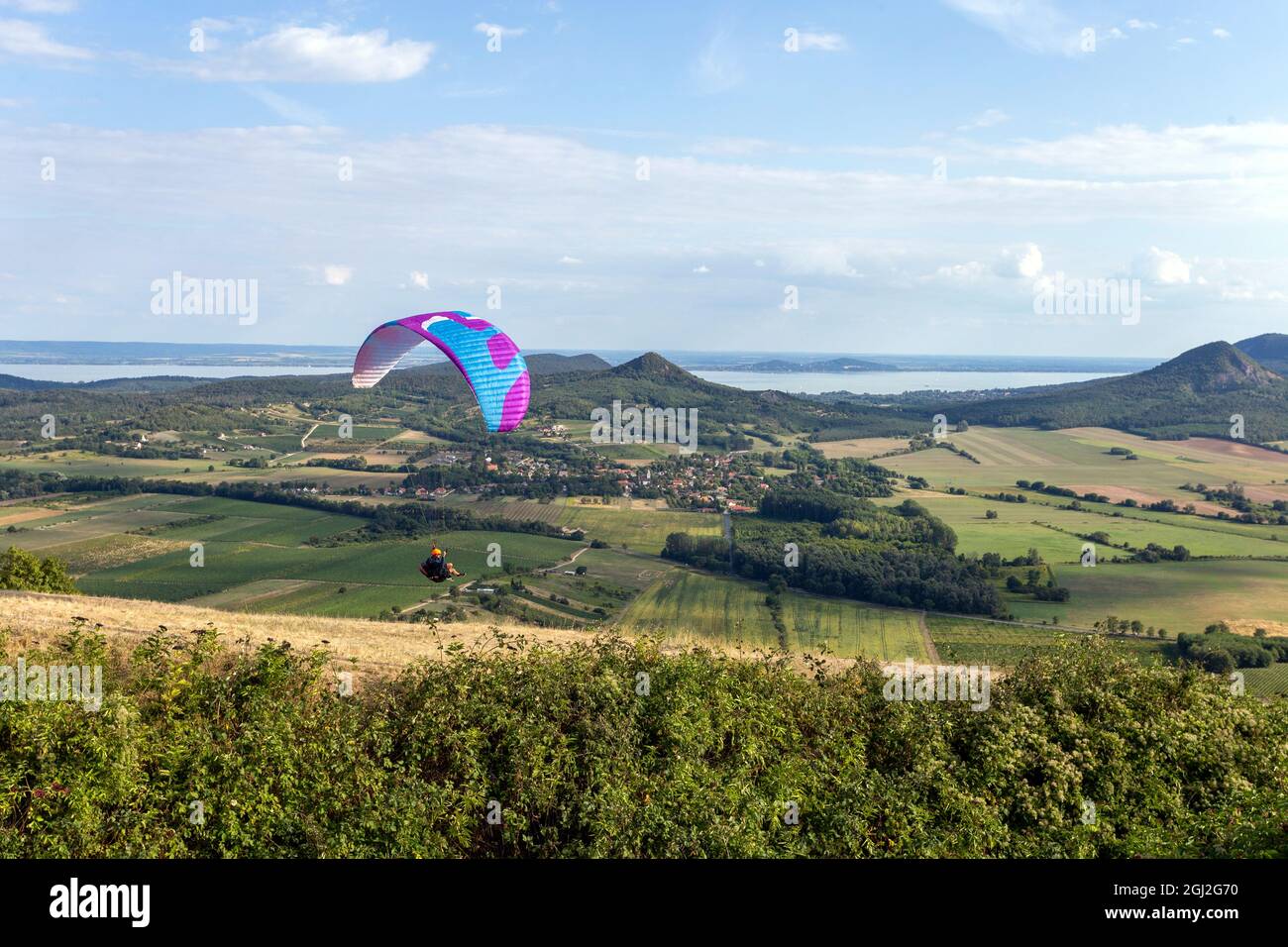 Paraglider over the mountains of lake Balaton in Hungary on a summer day  Stock Photo - Alamy