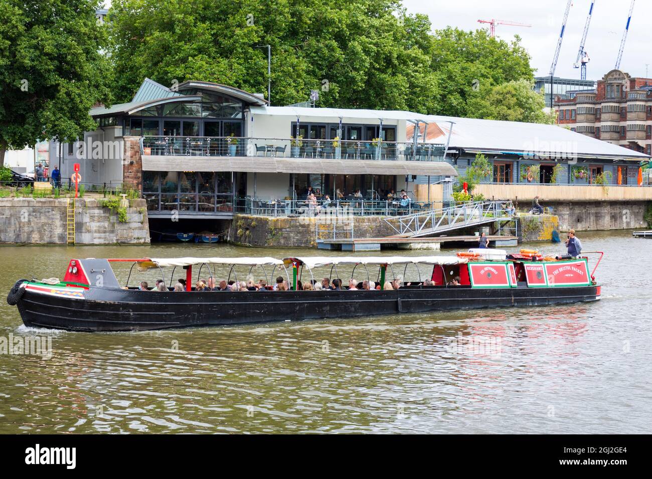 Harbour House bar restaurant and Bristol Packet tour boat in Bristol Harbour, UK Stock Photo