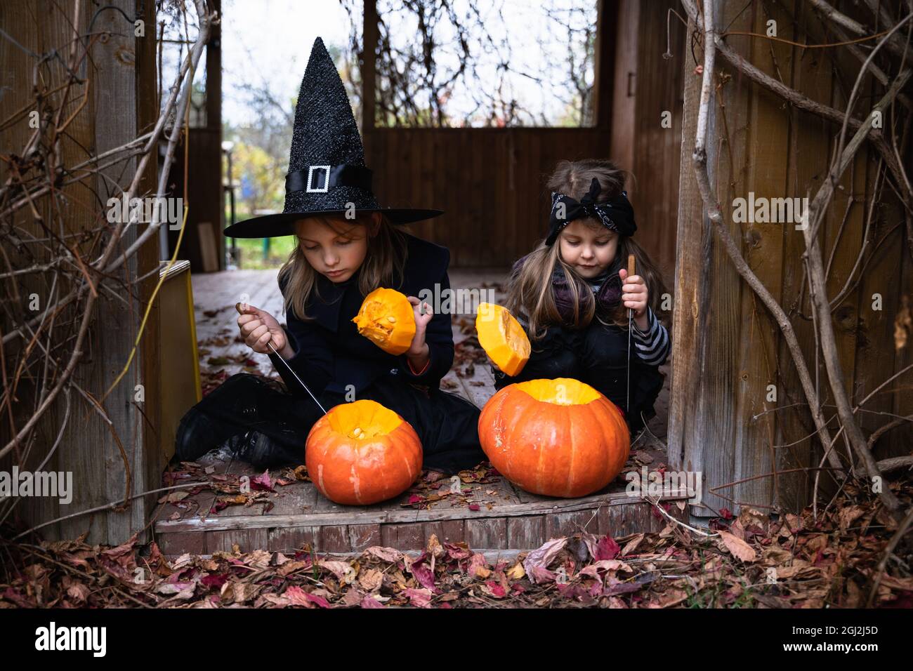Little girls make jack-o-lantern from 