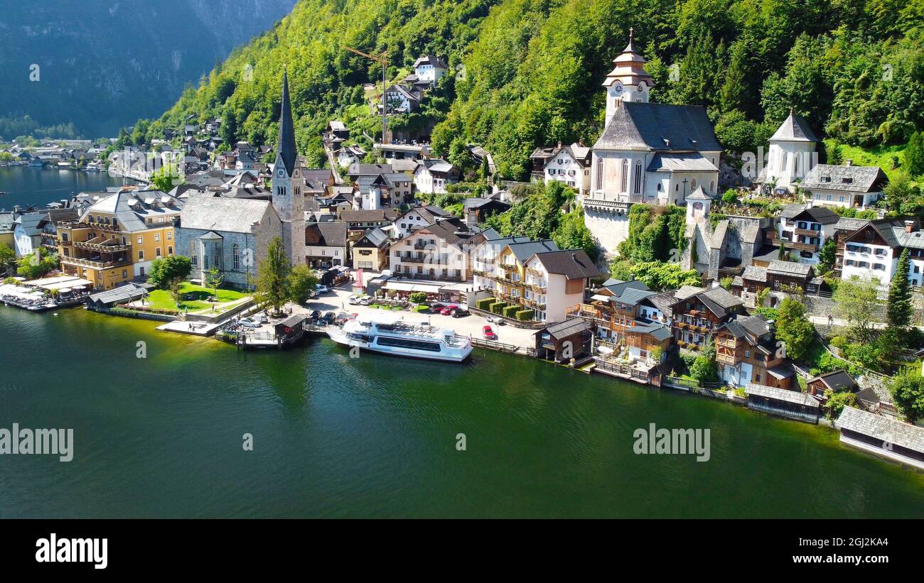 Hallstatt, Austria. Aerial view of the beautiful town from a flying drone over the lake in summer season Stock Photo