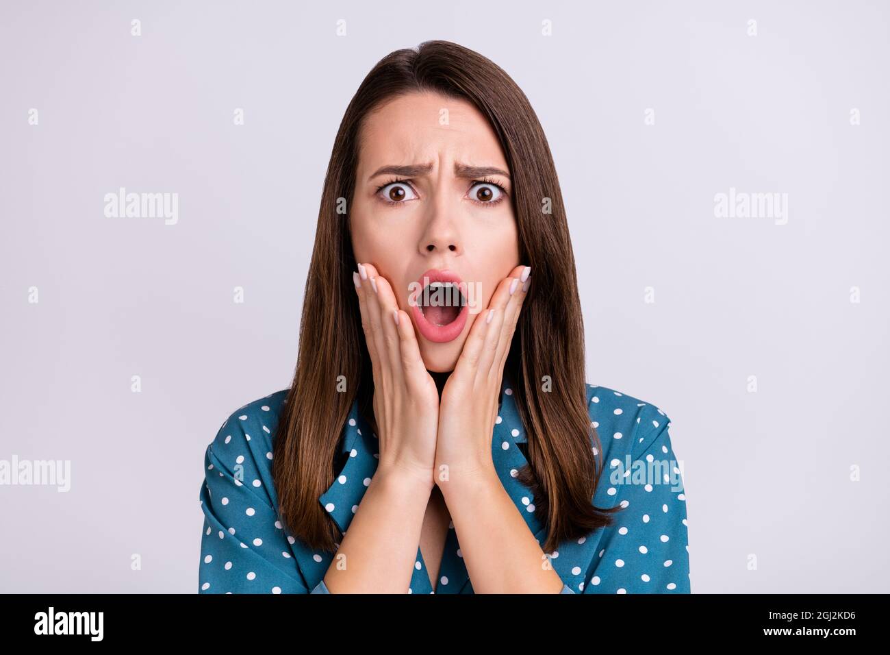 Photo of scared brunette hair millennial lady hands face wear blue ...