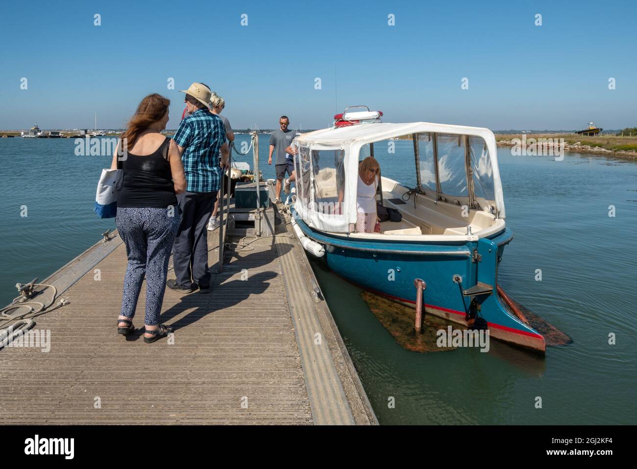 People boarding the Hurst Castle Ferry for the return trip to Keyhaven on a sunny day, Hampshire, England, UK Stock Photo