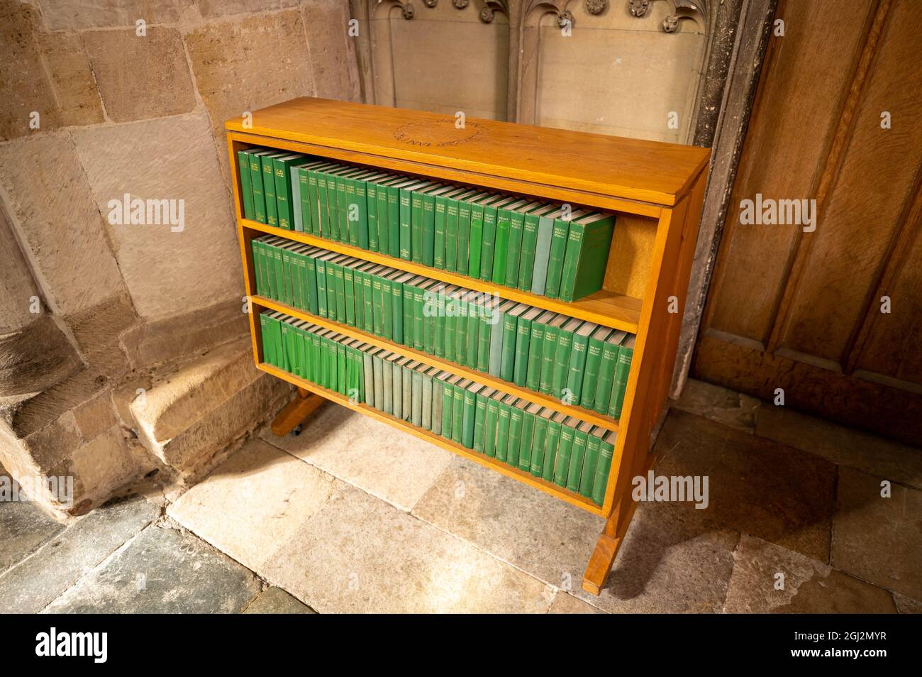 A bookcase of hymn books in norwich cathedral Stock Photo