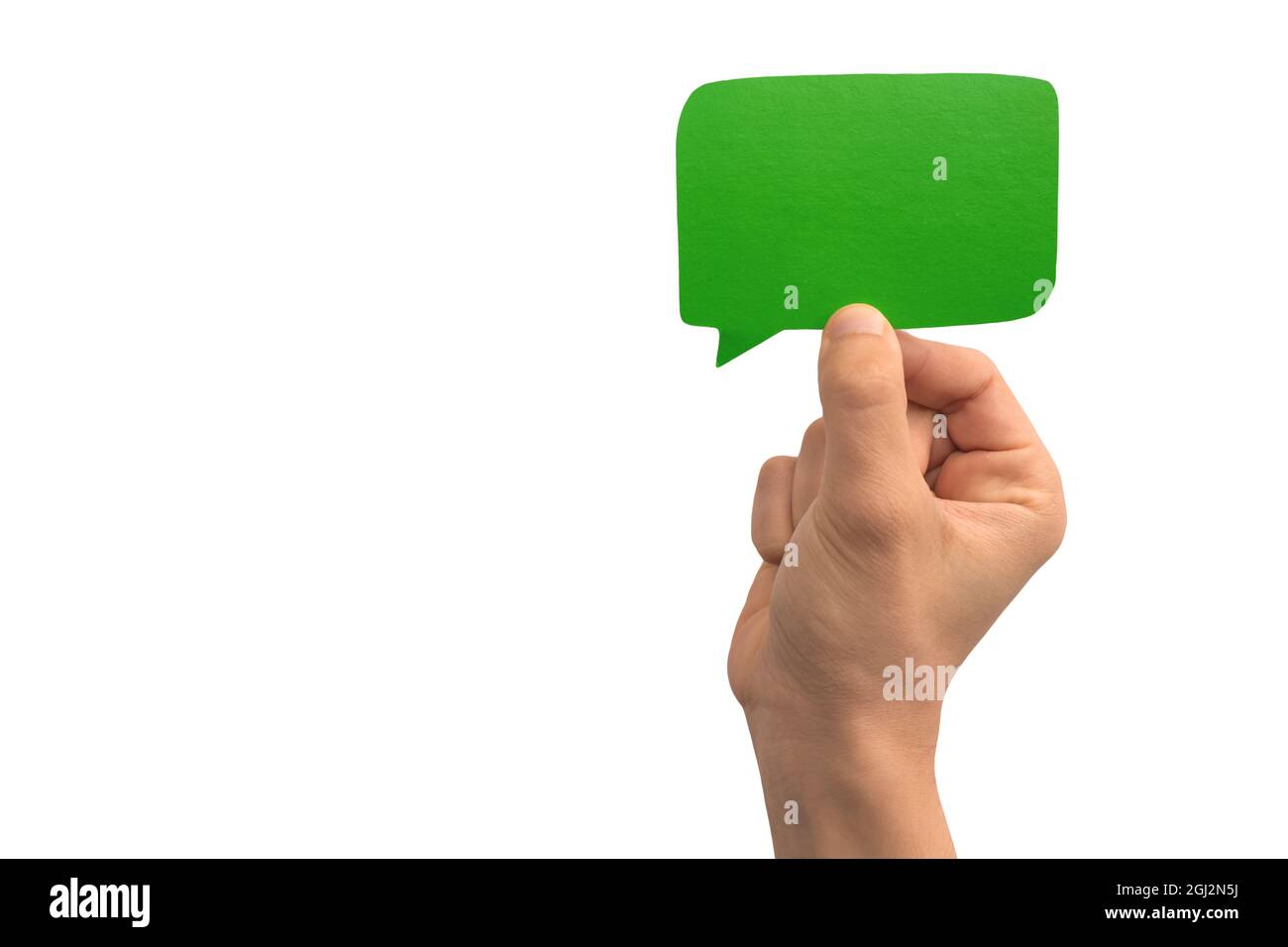 Hand holding a green blank speech bubble over white background photo Stock Photo