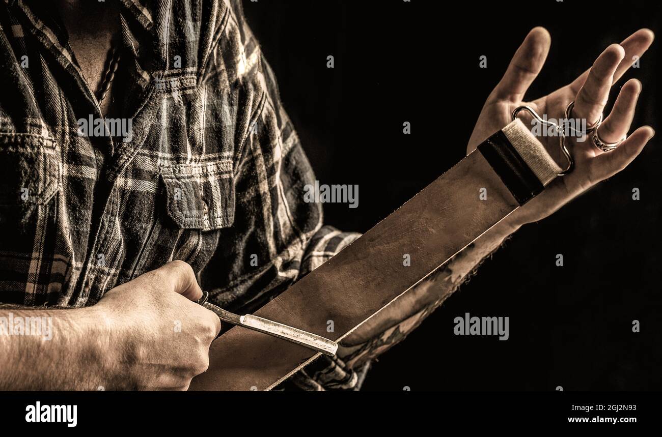Vintage tools for barbers, razor, sharpen the blade in leather brush