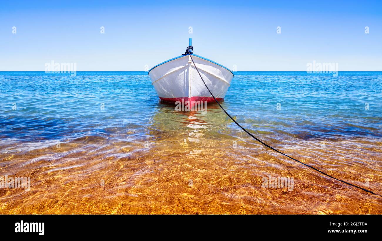 fishing boat on the blue sea Stock Photo - Alamy