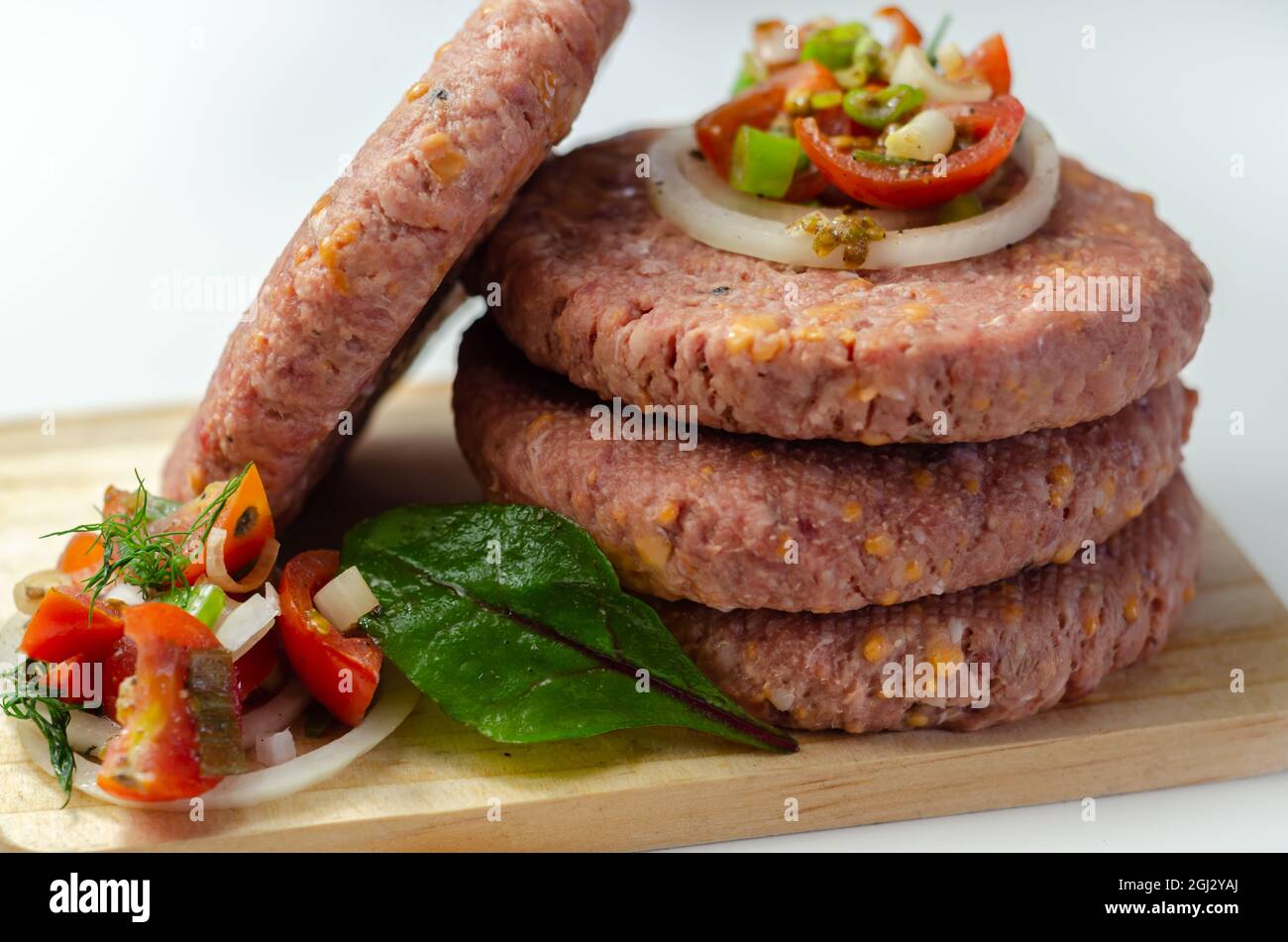 Raw beef burgers blended with caramelised red onion and tangy red