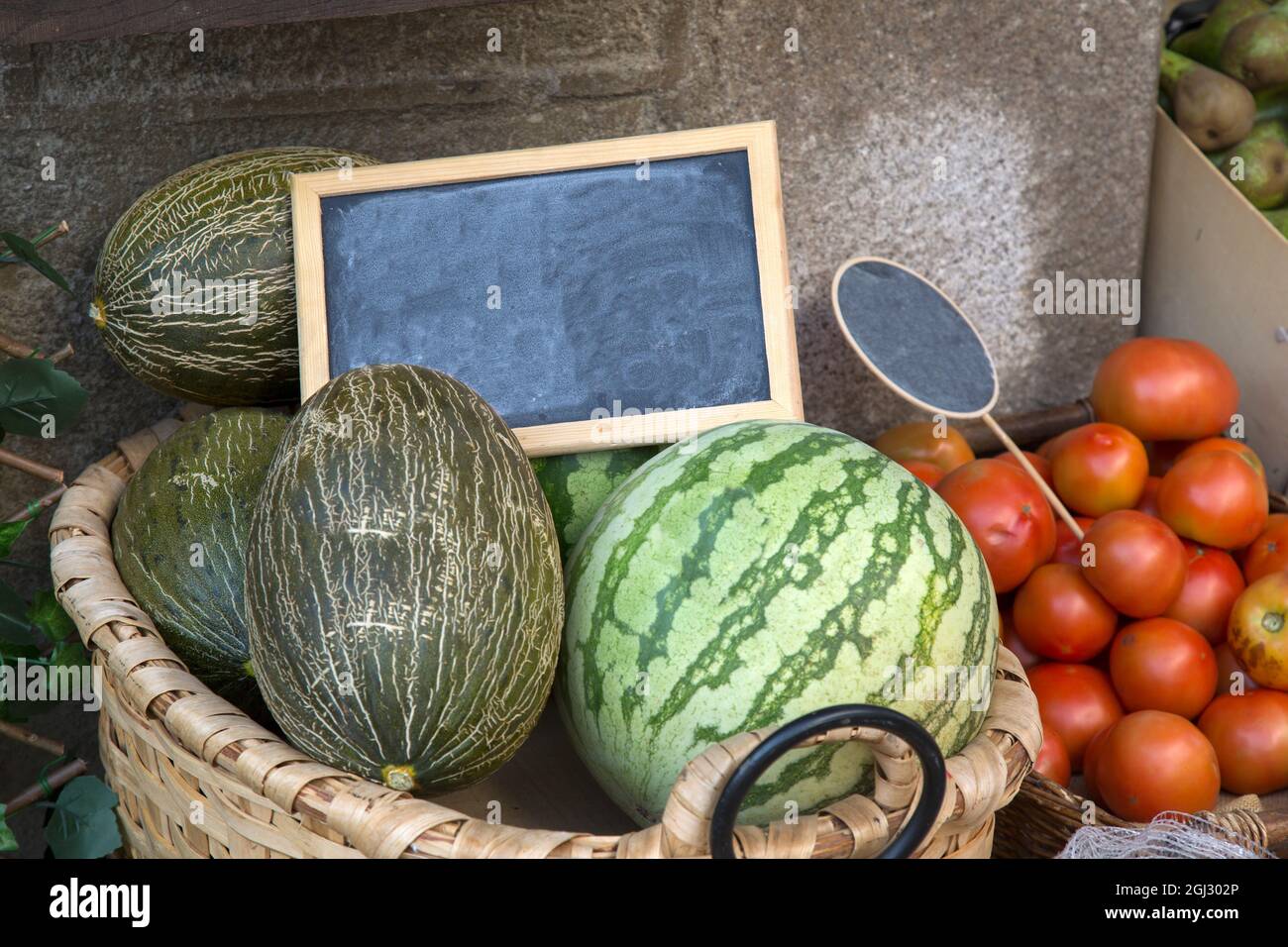 Green Melon and Red Tomatoes on Market Stall Stock Photo Alamy