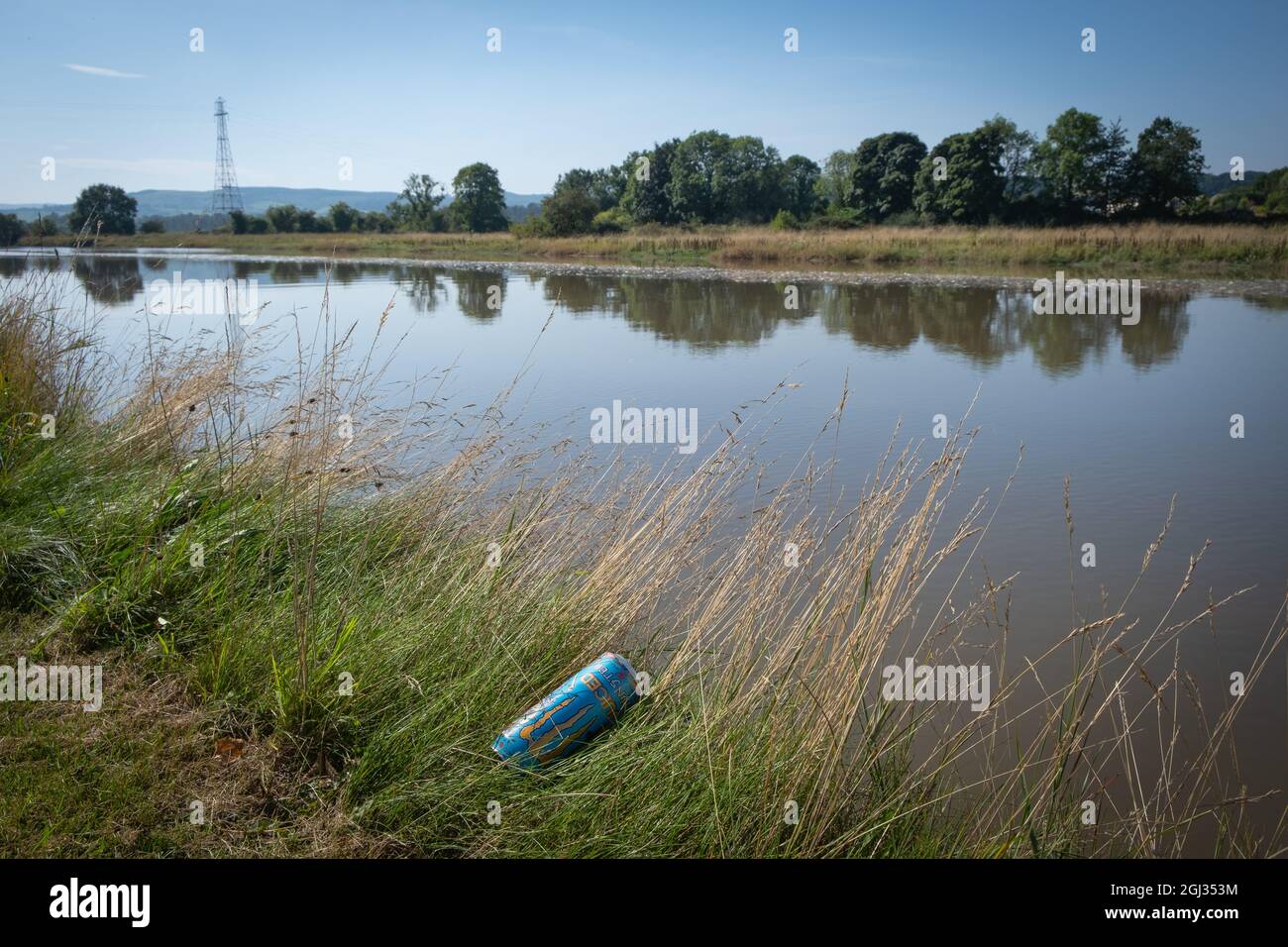 Monster energy drink can abandoned by the side of the River Nith, Kinghom Quay, near Dumfries, Scotland. Stock Photo