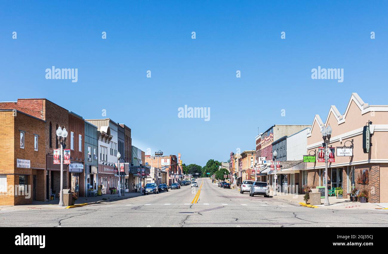 LUVERNE, MN, USA-21 AUGUST 2021: Wide angle view down Main Street, showing multiple buildings, blue sky. Stock Photo