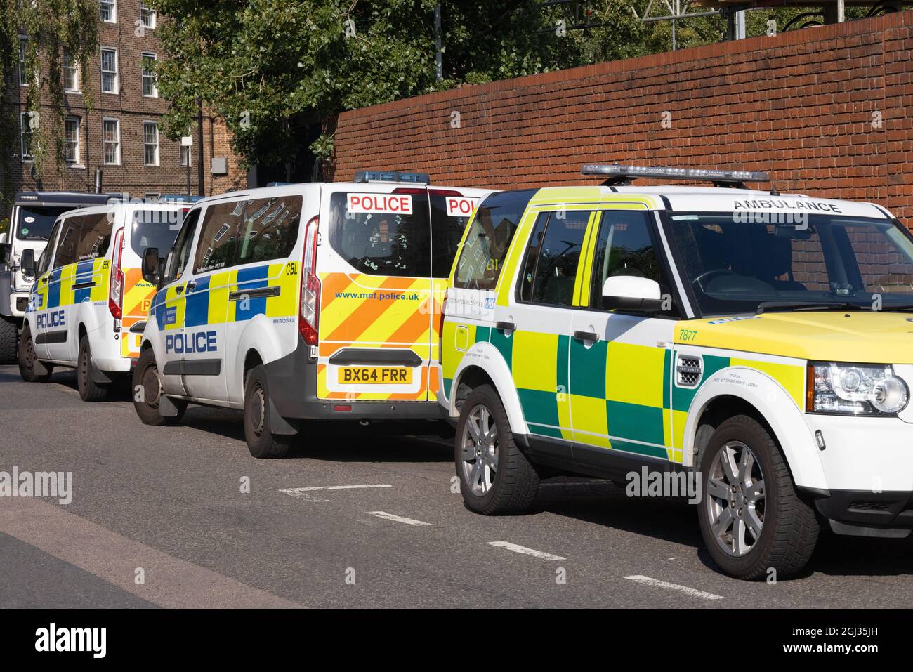UK Emergency services London; Emergency vehicles attending; Police cars and ambulance cars parked on the street, Kennington, London UK Stock Photo