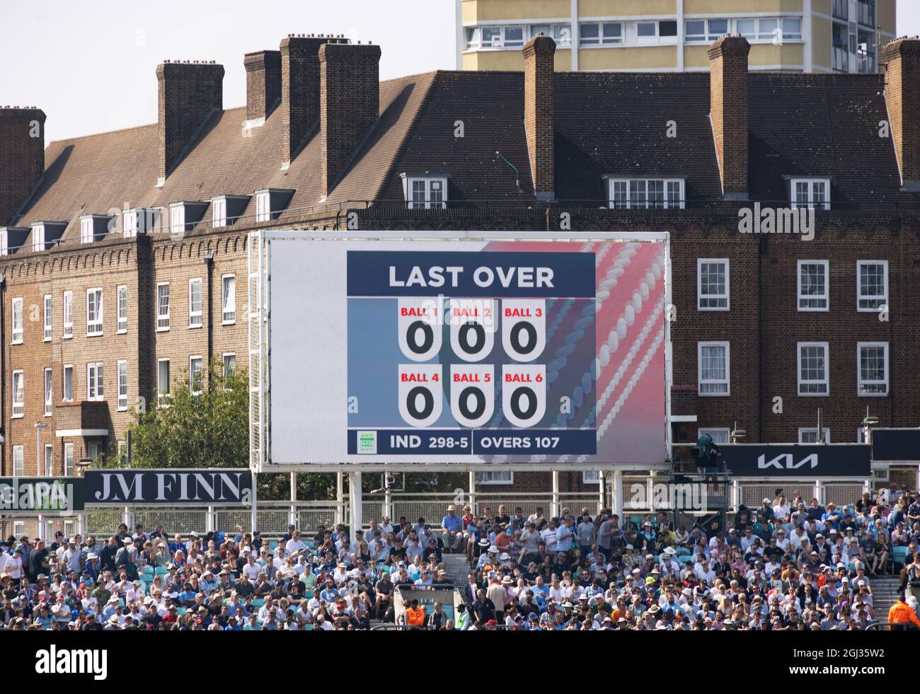 The Oval cricket scoreboard showing a maiden over, ie. no runs scored; The Oval cricket ground, London UK Stock Photo