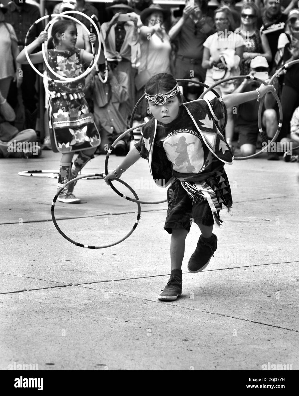 Young Native American hoop dancers perform at the annual Santa Fe Indian Market in Santa Fe, New Mexico. Stock Photo